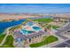 Aerial view highlighting the community pool, lake, and recreational facilities, promising a vibrant lifestyle at 20039 S 231St St, Queen Creek, AZ 85142