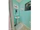 Stylish powder room featuring a pedestal sink, modern lighting, and colorful wall decor at 2019 N 78Th Ave, Phoenix, AZ 85035