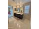Bathroom featuring a double sink vanity and large mirror at 2019 N 78Th Ave, Phoenix, AZ 85035