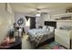 Cozy bedroom featuring carpet, ceiling fan, and window with black-out curtains at 2019 N 78Th Ave, Phoenix, AZ 85035