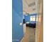 Bedroom featuring blue walls, carpet, and a window at 2019 N 78Th Ave, Phoenix, AZ 85035