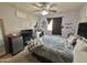 Bedroom showcasing a large bed, ceiling fan, and window at 2019 N 78Th Ave, Phoenix, AZ 85035