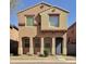 Charming two-story home with a blue front door, arched entry and a small front yard at 2019 N 78Th Ave, Phoenix, AZ 85035