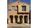 Charming two-story home with a blue front door, arched entry and a small front yard at 2019 N 78Th Ave, Phoenix, AZ 85035