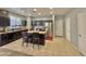 Modern kitchen featuring stainless steel appliances, dark cabinets, and a central island at 2019 N 78Th Ave, Phoenix, AZ 85035