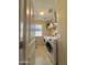 Laundry room with a washer and dryer, a window and storage at 2019 N 78Th Ave, Phoenix, AZ 85035