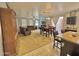 Spacious living and dining area with open floor plan, carpet and neutral color scheme at 2019 N 78Th Ave, Phoenix, AZ 85035