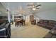 Bright and airy living room with plush seating, carpet and an open staircase at 2019 N 78Th Ave, Phoenix, AZ 85035