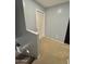 Top of stairs and open doorway with freshly painted neutral walls at 2019 N 78Th Ave, Phoenix, AZ 85035