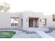Charming Southwestern-style home featuring desert landscaping, a covered entry, and decorative wooden accents at 2113 E Glencove St, Mesa, AZ 85213