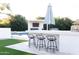 Outdoor bar with seating, umbrella, and easy access to the pool and entertainment area at 2113 E Glencove St, Mesa, AZ 85213
