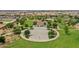 Aerial view of a basketball court and park, with houses in the distance at 22837 E Silver Creek Ln, Queen Creek, AZ 85142