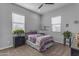 Bedroom featuring a queen sized bed with a grey ceiling fan at 22837 E Silver Creek Ln, Queen Creek, AZ 85142