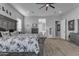 Bright bedroom with a large bed, natural light, and stylish decorations for a cozy feel at 22837 E Silver Creek Ln, Queen Creek, AZ 85142