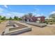 Community garden with raised planters and shaded seating areas at 22837 E Silver Creek Ln, Queen Creek, AZ 85142