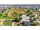 Aerial view of a community park with large field, basketball court, and green space at 22837 E Silver Creek Ln, Queen Creek, AZ 85142