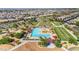 Aerial view of a community pool featuring shaded areas and plentiful green space at 22837 E Silver Creek Ln, Queen Creek, AZ 85142