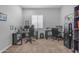 Spacious home office with two desks, multiple monitors, and comfortable office chairs at 22837 E Silver Creek Ln, Queen Creek, AZ 85142