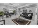 Bright living room featuring a piano, plush leather seating, and modern decor at 22837 E Silver Creek Ln, Queen Creek, AZ 85142
