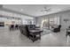 Spacious living room with plush seating, decorative rug, and access to the outdoor patio at 22837 E Silver Creek Ln, Queen Creek, AZ 85142