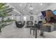 Open-concept living room with piano, leather sofas, and decorative plants at 22837 E Silver Creek Ln, Queen Creek, AZ 85142