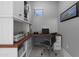 Stylish home office featuring custom cabinetry, a sleek desk, and abundant storage solutions, ideal for professional use at 22837 E Silver Creek Ln, Queen Creek, AZ 85142