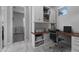 Bright home office with custom built-ins, modern desk, and ample storage, perfect for remote work and productivity at 22837 E Silver Creek Ln, Queen Creek, AZ 85142