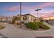 Corner lot home boasts tidy landscaping, a two-car garage, and sidewalk access at the intersection of Silver Creek Ln at 22837 E Silver Creek Ln, Queen Creek, AZ 85142