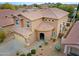 Aerial view of a two-story home with a tile roof, a two-car garage, and desert landscaping at 2527 W Amber Sun Dr, Phoenix, AZ 85085