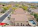 View of homes in a desert community with backyard pools and mountain views in the background at 2527 W Amber Sun Dr, Phoenix, AZ 85085