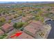 An aerial view shows a residential area featuring desert landscaping with mountains in the distance at 2527 W Amber Sun Dr, Phoenix, AZ 85085