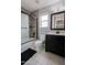 Bathroom featuring a tiled shower, toilet, and vanity with a mirror and sink at 2527 W Amber Sun Dr, Phoenix, AZ 85085