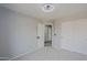 Bright bedroom features neutral walls, carpet, and large closet with white sliding doors at 2527 W Amber Sun Dr, Phoenix, AZ 85085