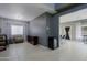Relaxing bonus room featuring neutral walls, tile floor, open layout, and wine cooler at 2527 W Amber Sun Dr, Phoenix, AZ 85085