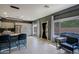 Open kitchen and breakfast nook leading to an outdoor pool, with tiled floors at 2527 W Amber Sun Dr, Phoenix, AZ 85085