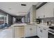 Bright kitchen featuring granite countertops, stainless steel appliances, and white cabinetry at 2527 W Amber Sun Dr, Phoenix, AZ 85085