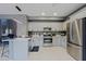 Spacious kitchen with granite countertops, stainless steel appliances, and center island at 2527 W Amber Sun Dr, Phoenix, AZ 85085