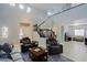 Spacious living room with comfortable seating, high ceilings, and staircase at 2527 W Amber Sun Dr, Phoenix, AZ 85085
