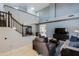 Inviting living room with high ceilings, staircase, and comfortable seating arrangement at 2527 W Amber Sun Dr, Phoenix, AZ 85085