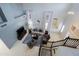 Open-concept living room with high ceilings, stylish furniture, and staircase from above at 2527 W Amber Sun Dr, Phoenix, AZ 85085