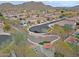 Aerial showcases a well-maintained neighborhood with a park and mountain views at 2527 W Amber Sun Dr, Phoenix, AZ 85085