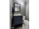 Stylish powder room featuring a modern vanity, mirror, and a clean design at 2527 W Amber Sun Dr, Phoenix, AZ 85085