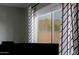 This window has a mountain view with black and white patterned curtains adding to the design at 2527 W Amber Sun Dr, Phoenix, AZ 85085