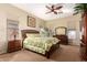 Relaxing main bedroom suite with ceiling fan, a double bed, and natural light at 26826 N 66Th Ln, Phoenix, AZ 85083
