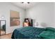 Cozy bedroom with a dresser, mirror, and ceiling fan, illuminated by natural light at 26826 N 66Th Ln, Phoenix, AZ 85083