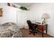 Bedroom with desk, chair, and built-in shelving at 26826 N 66Th Ln, Phoenix, AZ 85083