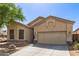 Charming home exterior features a two-car garage, manicured landscaping, and inviting curb appeal at 26826 N 66Th Ln, Phoenix, AZ 85083