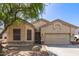Charming home exterior features a two-car garage, manicured landscaping, and inviting curb appeal at 26826 N 66Th Ln, Phoenix, AZ 85083