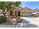 Charming home with a well-manicured yard, mature tree, and a two-car garage at 26826 N 66Th Ln, Phoenix, AZ 85083