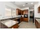 Well-equipped kitchen with wooden cabinets, modern appliances, and ample counter space for meal preparation at 26826 N 66Th Ln, Phoenix, AZ 85083